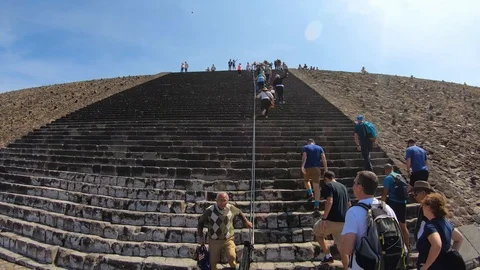 People climbing the middle section of the pyramid of the sun Stock Footage 98008274