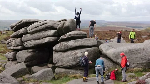People climbing on rocks Stock Footage 140518538