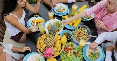 People Clink Juice Glasses, Friends Eating Healthy Vegetarian Food Top Angle Stock Footage 81198528