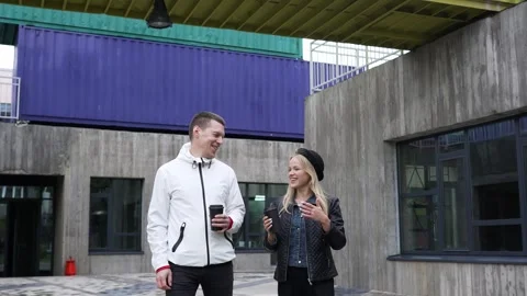 People with coffee passing by talking energetically. Stock Footage 263537720
