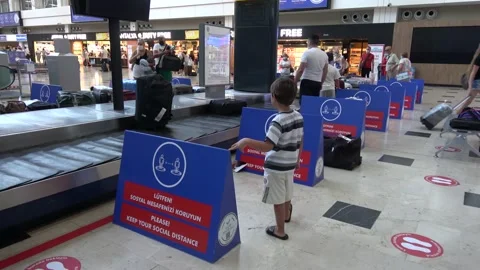 People collect their baggage on arrival to Anatalya airport Stock Footage 140336659