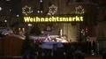 People coming from Christmas market with night light illumination Brunswick city 4k or 4k+ Resolution