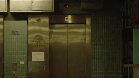 People coming out of an elevator while people passing by busily, Mong Kok Stock Footage 295919811