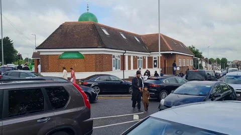 People Coming out of Mosque After Eid Prayers Luton City UK 29-6-2023 Stock Footage 244839608