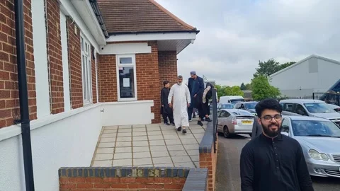 People Coming out of Mosque After Eid Prayers Luton City UK 29-6-2023 Stock Footage 244839656