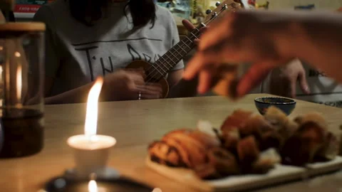 People communicate in the evening kitchen at table at home. closeup tea party Stock Footage 236945272