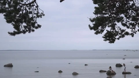 People communicate far on the rocks Stock Footage 73775464