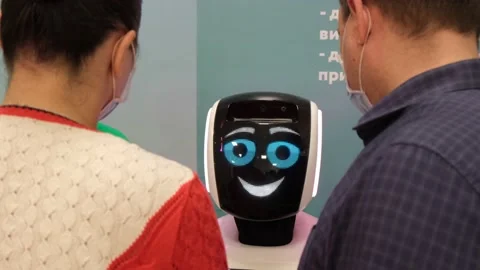 People communicate with the robot, modern technologies. Stock Footage 154775689