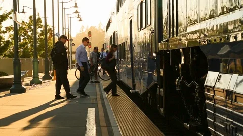 People commuters boarding a train at rush hour using mass transit HD Stock Footage 105196288