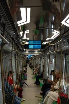 People commuting inside a modern subway train carriage. Russia - 28 July 2026 Stock Photos