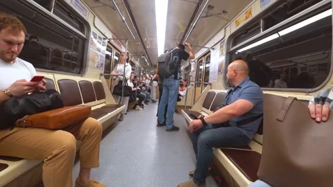 People commuting inside a moving subway train Stock Footage 324718210