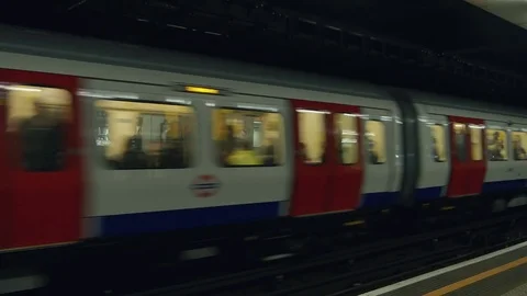 People commuting via tube underground train in London Stock Footage 71795828