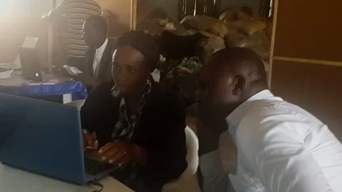 People at a Computer at Aid Station  co 動画素材 116625108