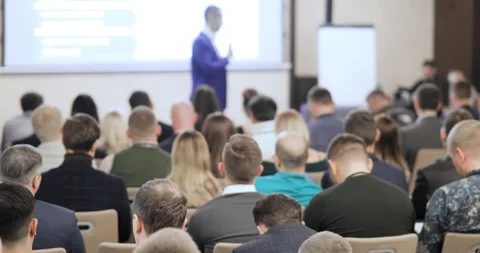 People at a conference or presentation, workshop, master class photograph. Back Stock Footage 100096809