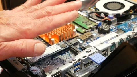 People consider the internal elements of  computer (trade equipment POS system)  Stock Footage 122030021