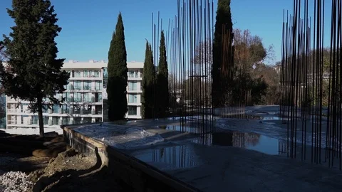 People in construction helmets go on a construction site. Businessmen inspect Stock Footage 125035499