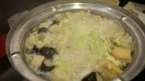 People cooking hot pot Stock Footage 71002829