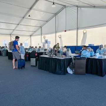 People at a Covid 19 testing facility provided by Norwegian Cruise Line pri.. Stock Photos