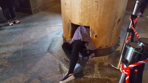 People crawling through hole in column at Todaji temple in Nara Stock Footage 135176949