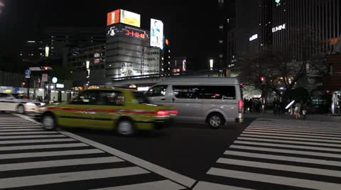 People cross a busy intersection in Ginza, Tokyo. Stock Footage 25822179