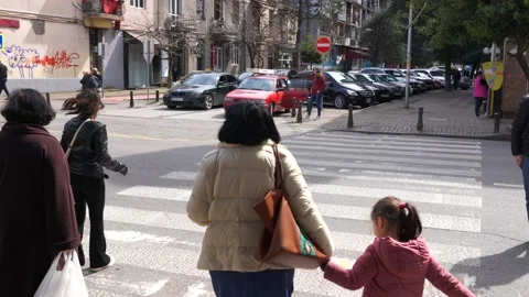People cross the road Stock Footage 151027235