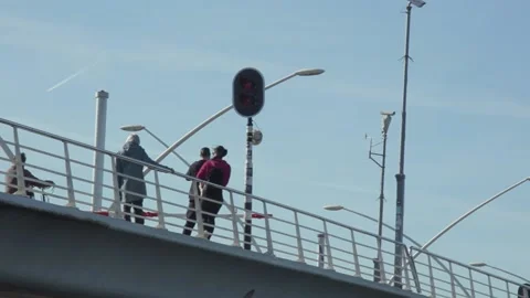 People Crossing Bridge Stock Footage 132977780