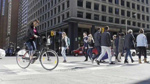 People crossing busy intersection Stock Footage 101812278