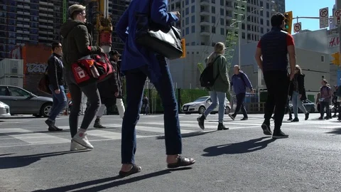 People crossing busy intersection Stock Footage 101812294