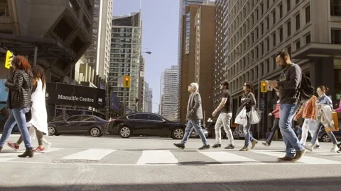 People crossing busy intersection Stock Footage 101812301