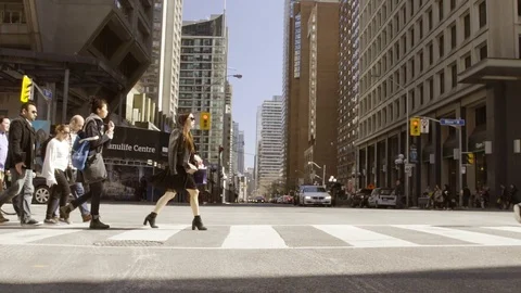 People crossing busy intersection Stock Footage 101812331