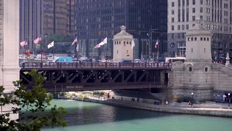 People crossing the DuSable bridge during a workweek in the downtown Stock Footage 95767908