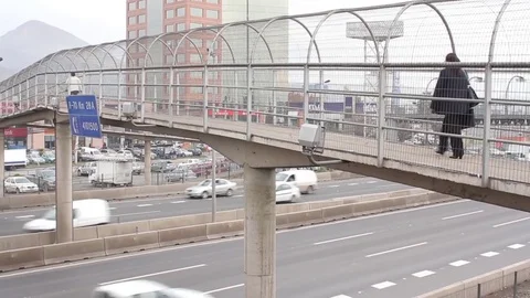 People crossing highway platform Stock Footage 77045386