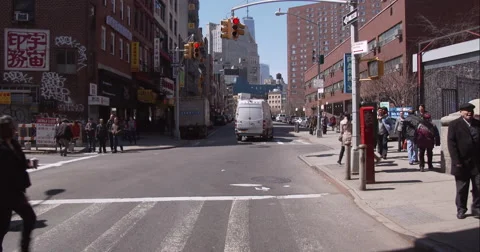 People crossing an intersection in Chinatown Stock Footage 51260956