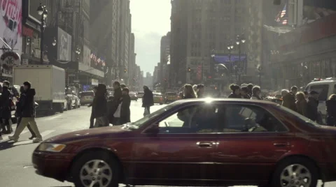 People crossing intersection walking across street cars driving slow motion NYC Stock Footage 58235106