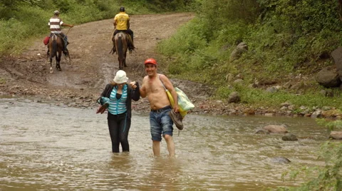 People crossing river Stock Footage 43106834