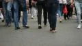 People crossing road after cars drive by, feet only, realtime HD Footage