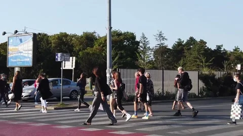 People crossing the road slow motion on a sunny day in Belgrade Stock Footage