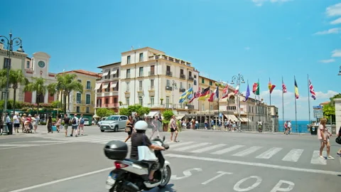 People crossing the road surrounded by flags in Europe. Stock Footage 237086990