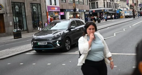 People crossing the road within The Strand, London, United Kingdom Stock Footage 247437337