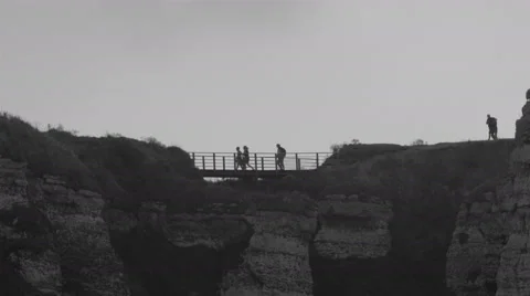 People crossing the small bridge in the mountain Stock Footage 55355809