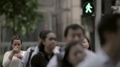 People at the crossroads of Singapore Stock Footage