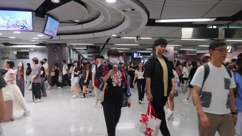 People crowd coming out from gate Causeway Bay MTR Station concourse Stock Footage 313798868