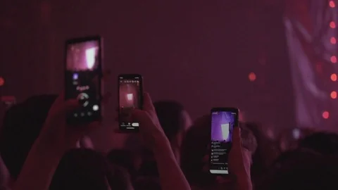  people in the crowd dance and shoot videos on mobile phones Video stock 126358741