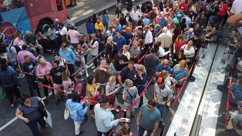 People crowd in front of TKTS box office in Manhattan for cheap Broadway Stock Footage 121847680
