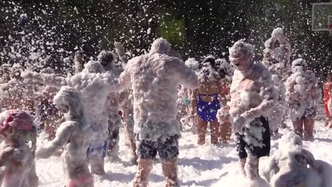 People Crowd Have Fun and Dance at Foam Day Beach Disco Music Party. Stock Footage 77997393