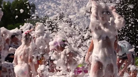 People Crowd Have Fun and Dance at Foam Day Disco Music Party. Slow Motion. Stock Footage 77998348