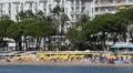 People Crowd swimming sunbathing Sandy Beach Cannes Famous French Riviera day HD Footage
