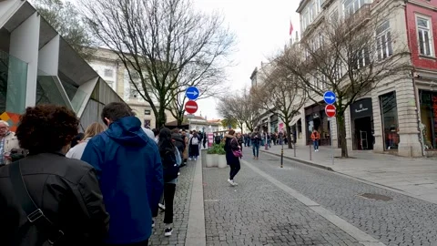 People Crowd waiting in queue outside Livarella Lello Bookstore Porto Portugal Video stock 245278383