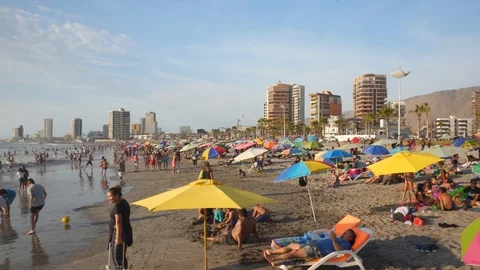 People at Crowded Beach. Camera Moves Forward Parallel to Coastline. 스톡 동영상 103335164