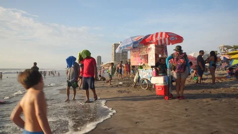 People at Crowded Beach. Camera Moves Forward Parallel to Coastline. 스톡 동영상 103335286